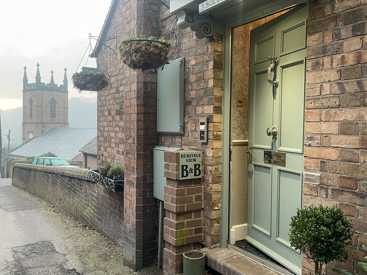 The guest house entrance and church